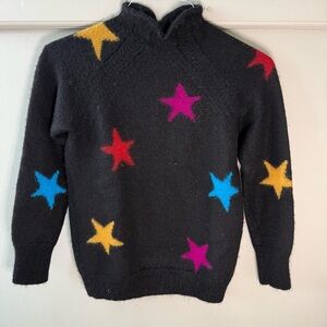 Veda Black Knit Turtleneck Sweater with Vibrant Stars Blue Yellow Red Pink